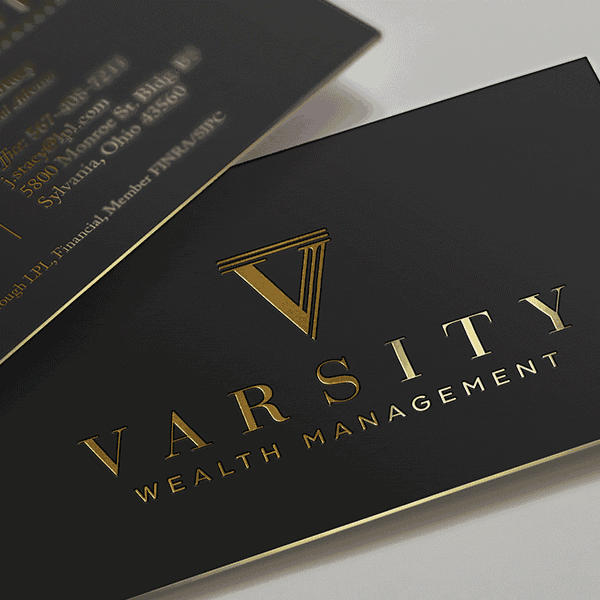 gold logo of the letter V with lines going across its top to suggest a Grecian column